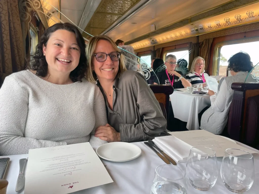 Kristen Bawden and Lindsey McHugh sat at the dining table on The Ghan train