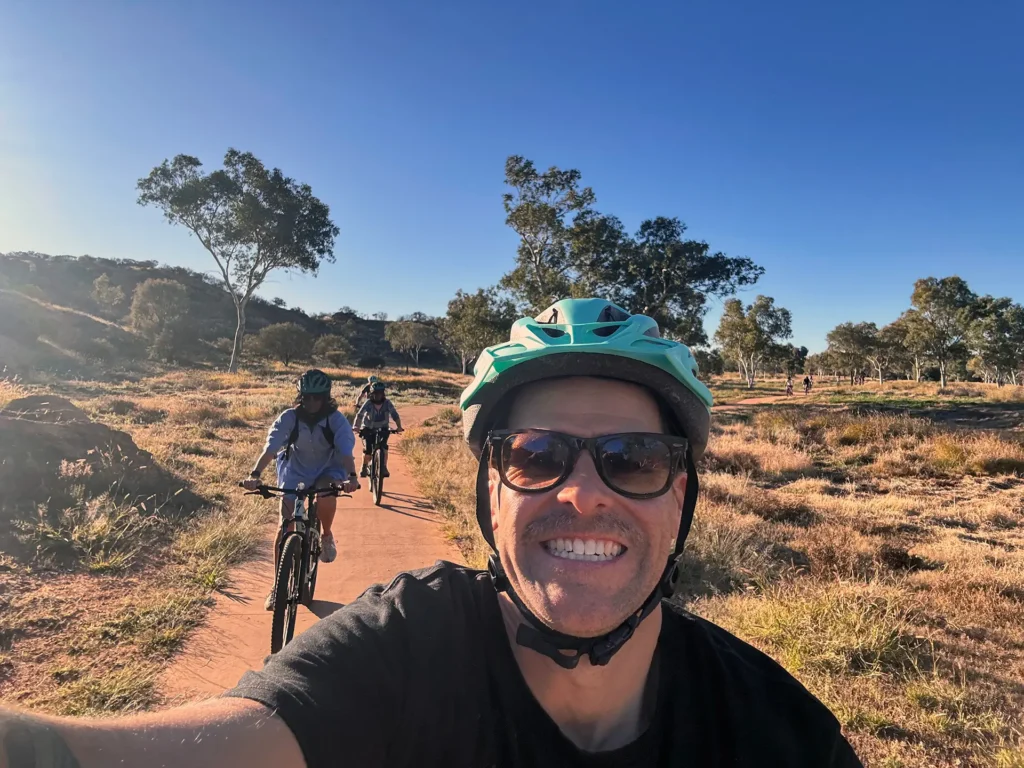 Selfie of Cohan Banfield and Lindsey McHugh on a mountain bike adventure during their trip on The Ghan