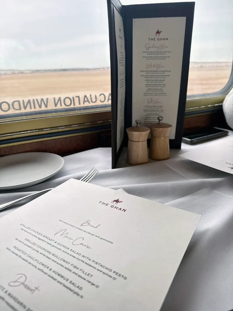 View of the menu on a table inside The Ghan train